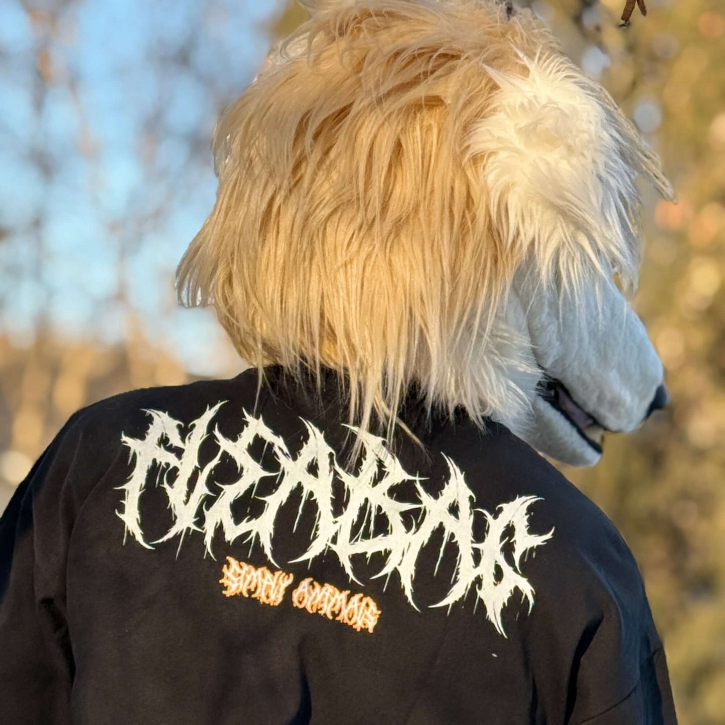 Ravenous Tee featuring graphic design on a cotton oversized shirt worn by a model in a borzoi mask.