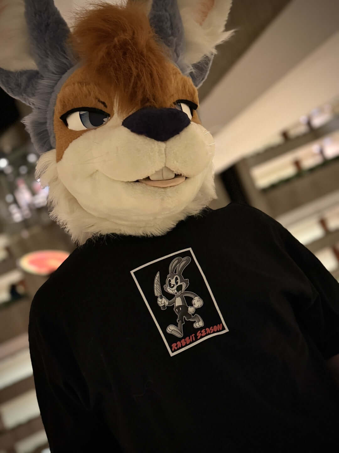 Rabbit fursuiter model wearing Rabbit Season Tee
