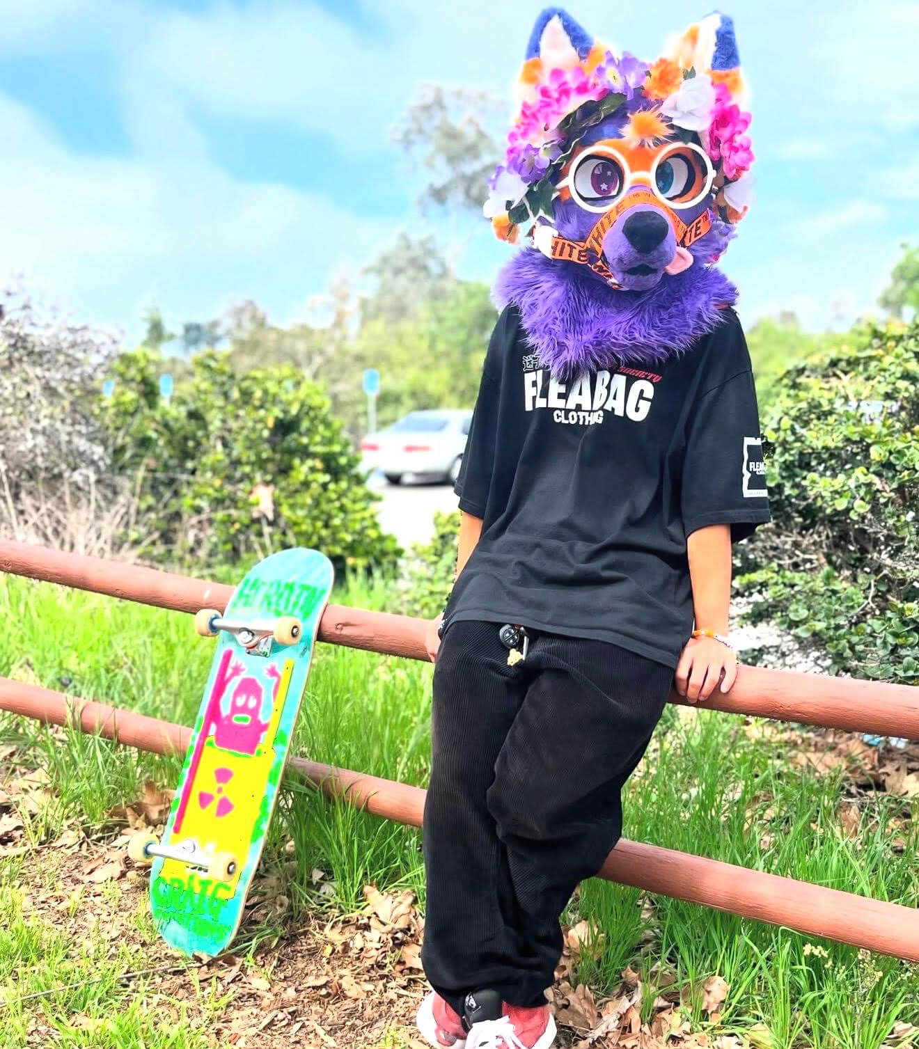 Model wearing Simply Animals Tee near skateboard.