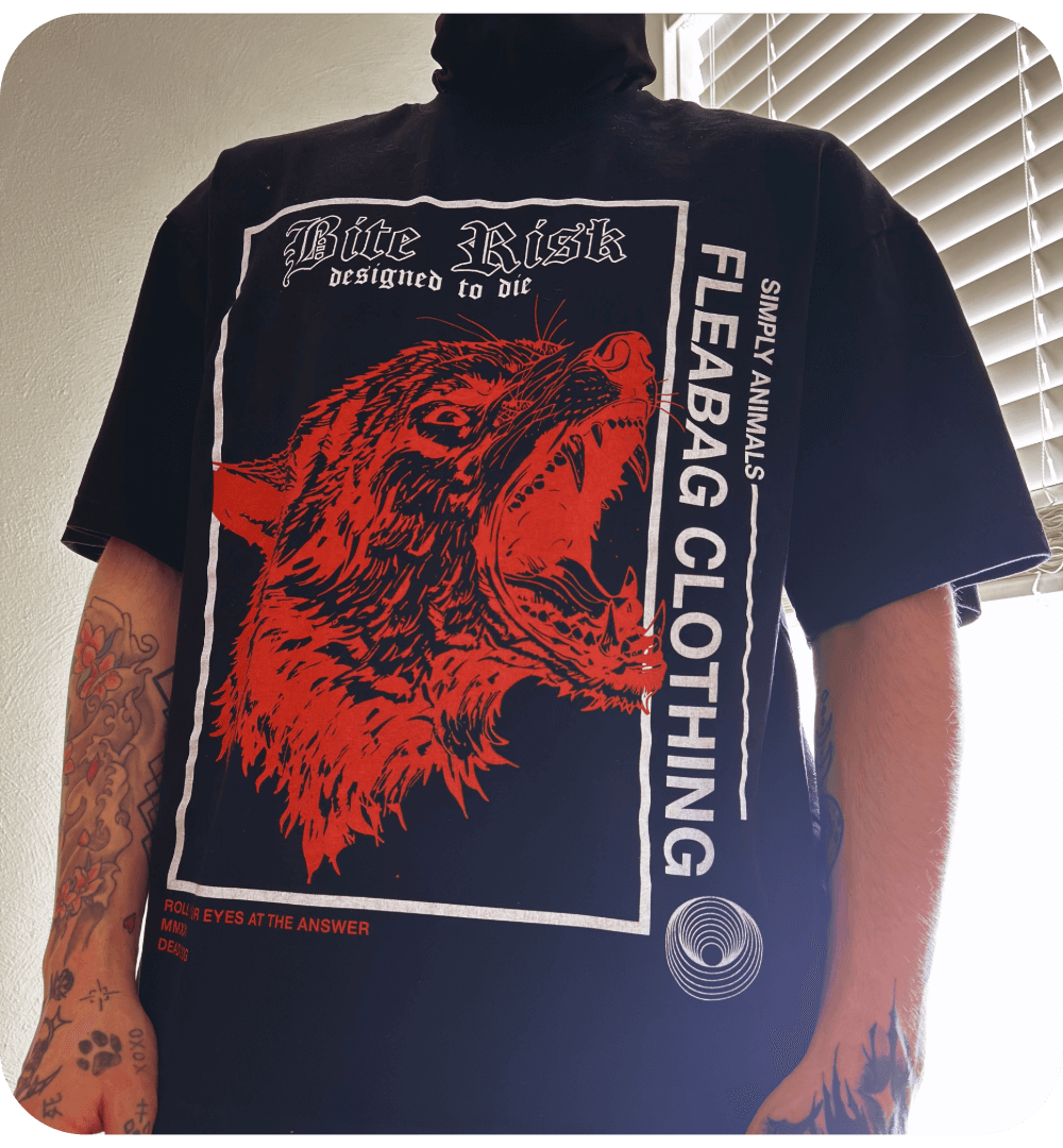 Model wearing Bite Risk Tee in oversized fit, showcasing 100% cotton fabric with bold graphics.