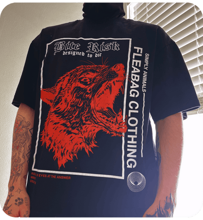 Model wearing Bite Risk Tee in oversized fit, showcasing 100% cotton fabric with bold graphics.